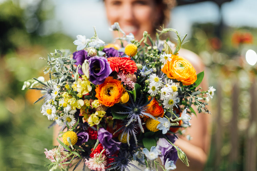 Bridal bouquet showcasing vibrant spring flowers in full bloom.
