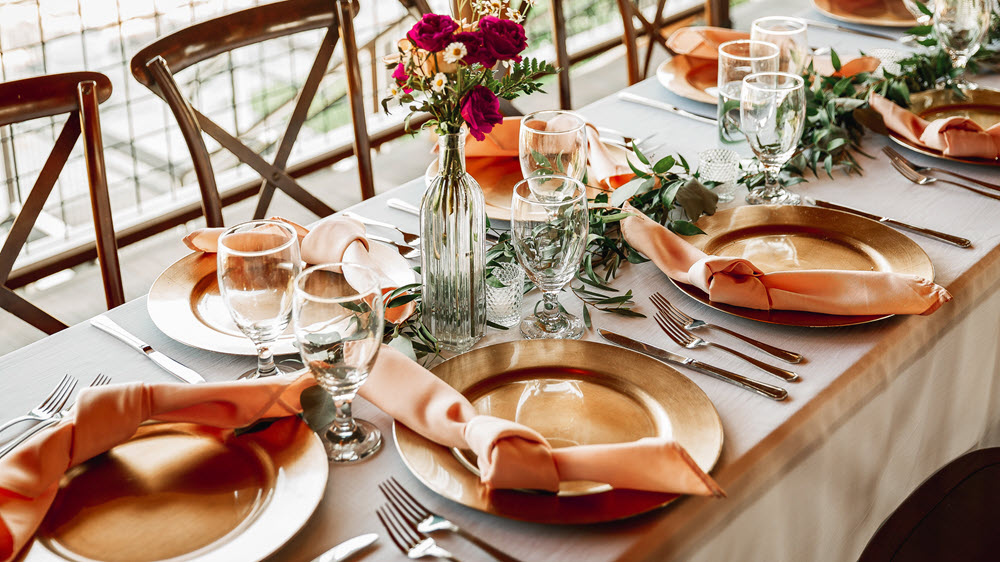 Elegant table setting showcased while exploring wedding venue options.