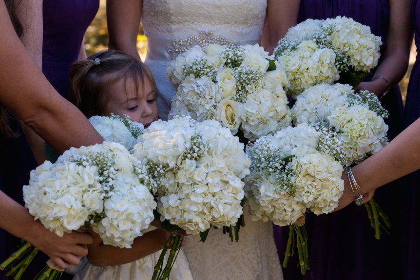 Bride, bridesmaids and flower girl with bouquets