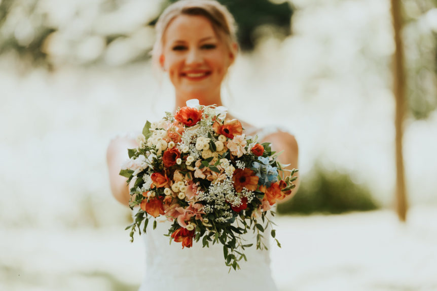 Smiling Bride Holding Her Wedding Bouquet