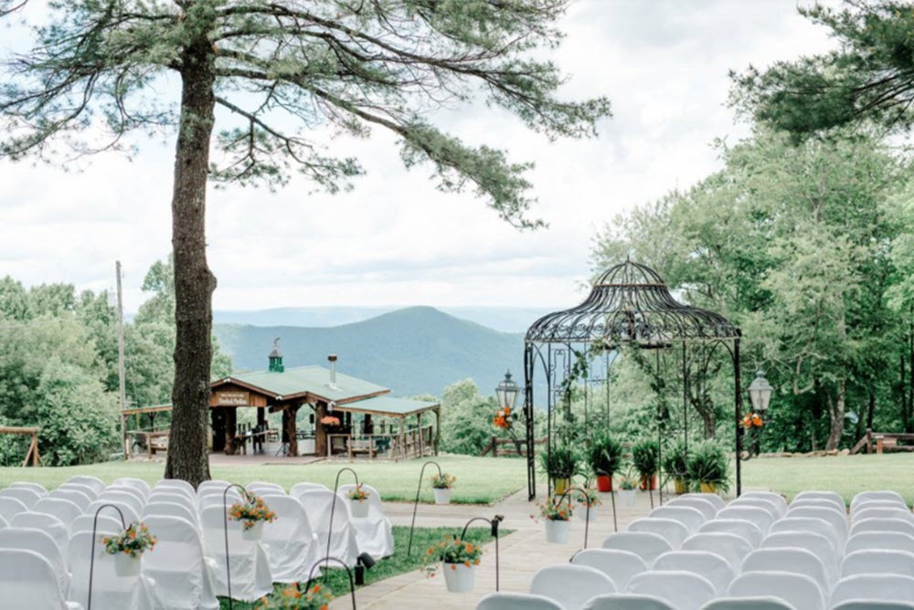 Sunset ceremony at Silver Hearth Lodge, capturing the magical ambiance of Virginia's intimate wedding location.