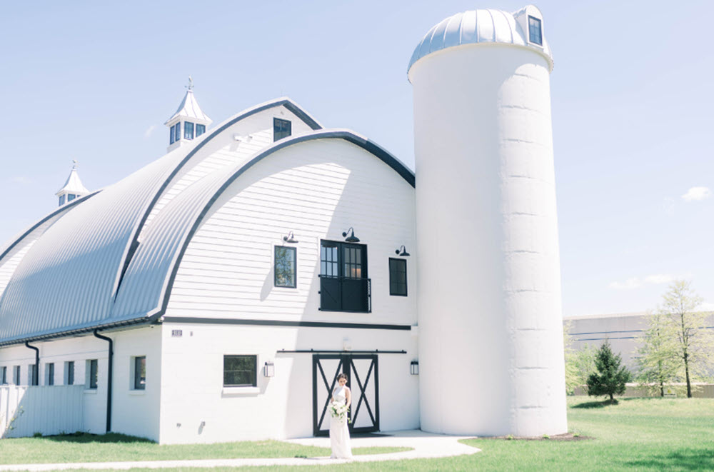 Elegant outdoor barn wedding venue at Sweeney Barn with panoramic views of Northern Virginia's landscape.