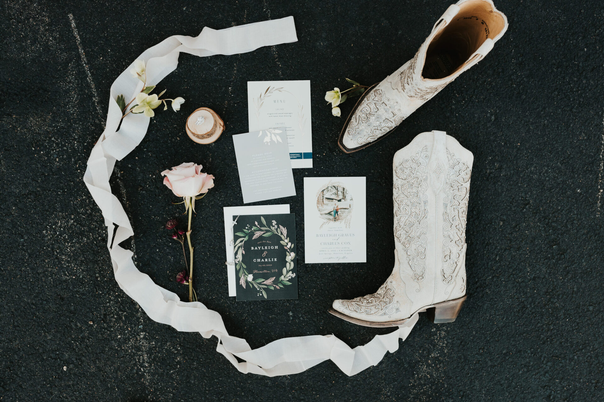 wedding invitation and save-the-date with cowboy boots, rings, roses and white flowers