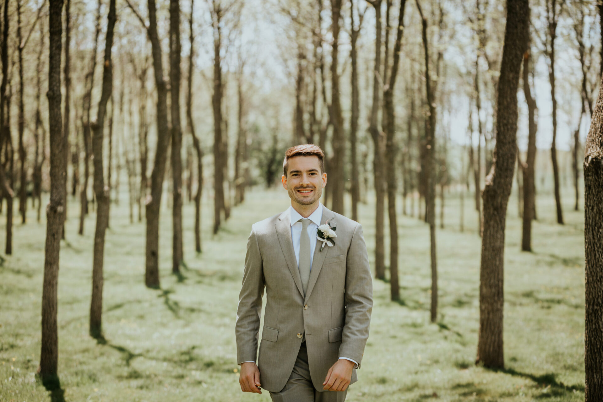 Zion Springs Real Wedding groom walking in walnut grove