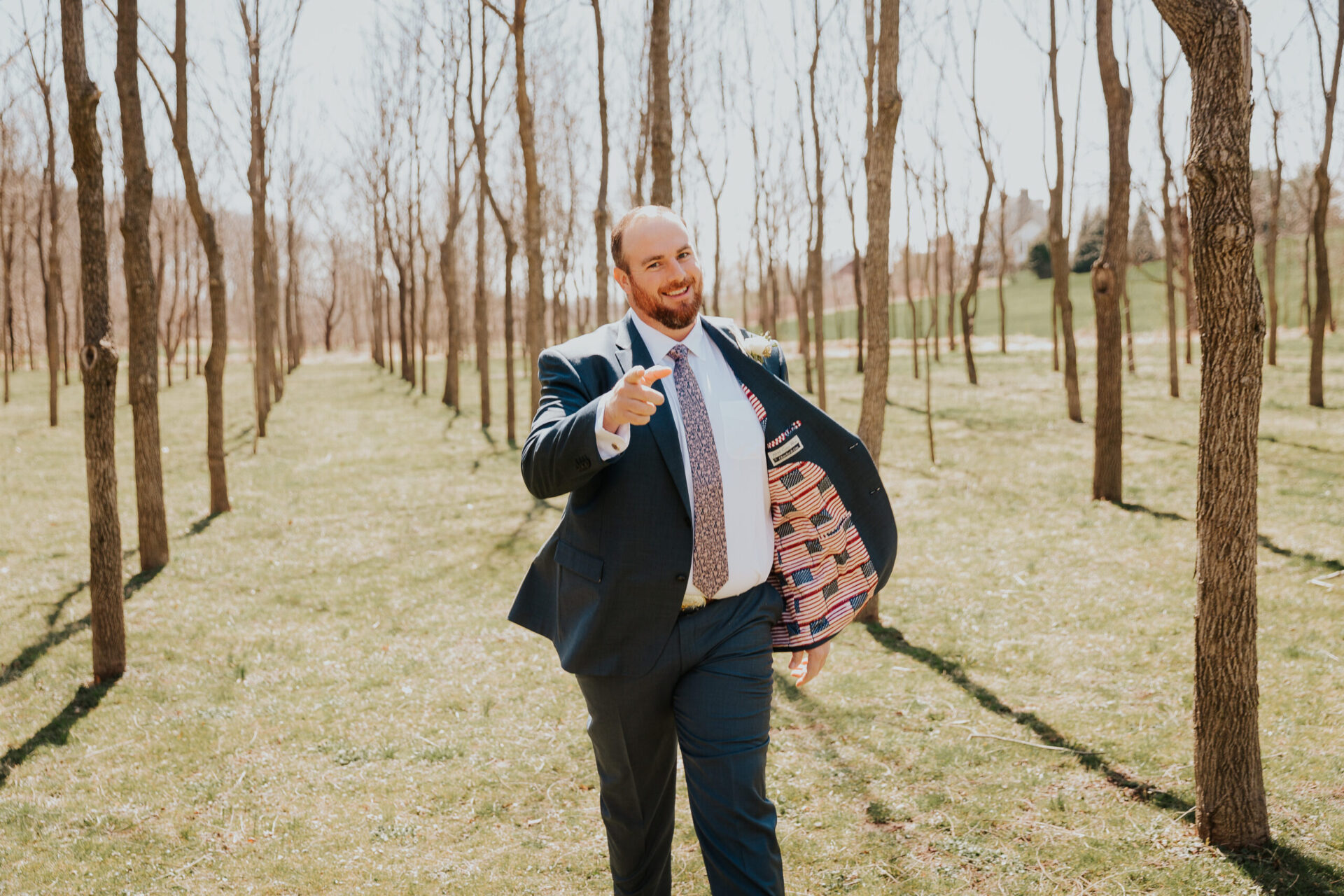 Zion Springs groom in walnut grove with American flag suit