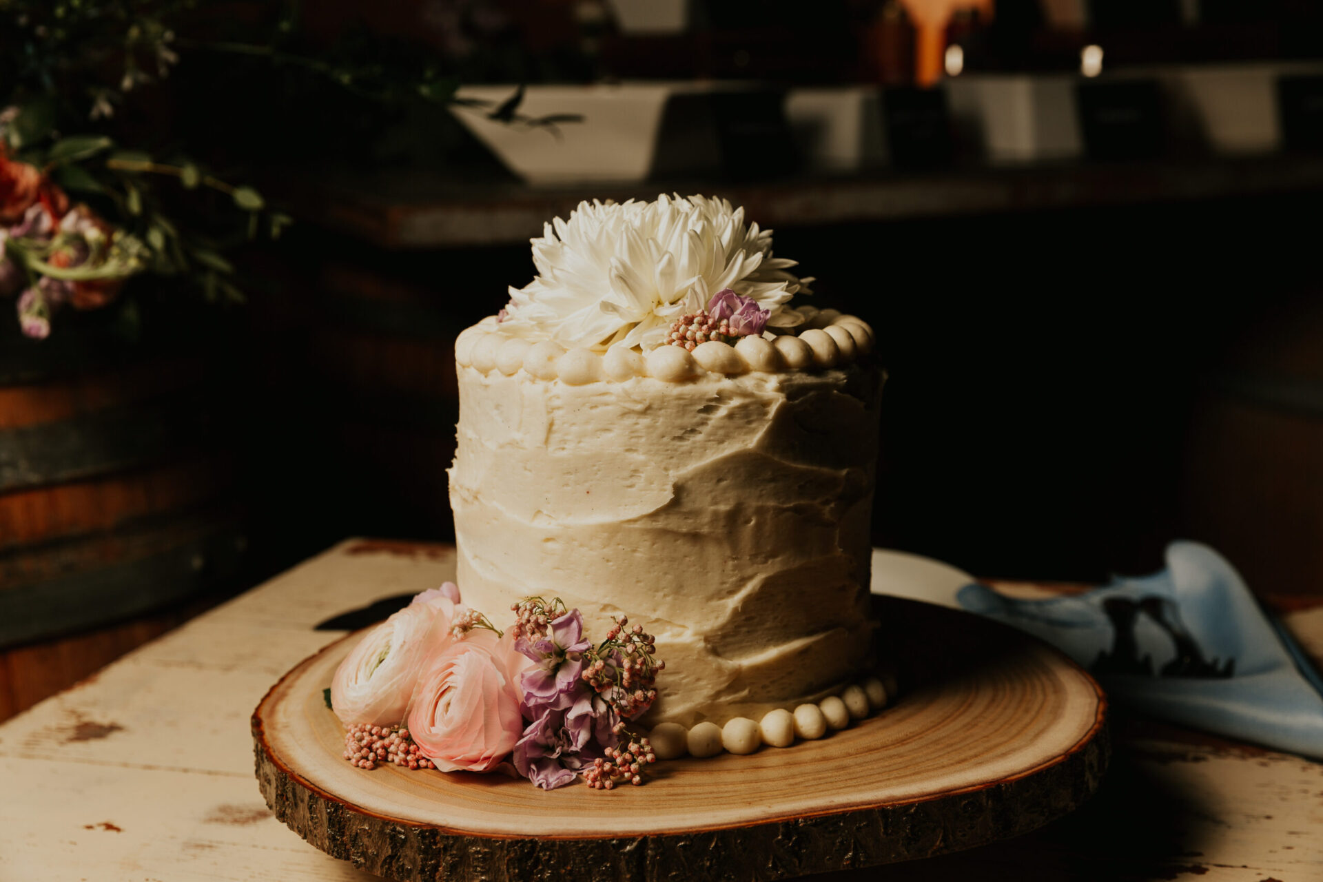 Zion Springs wedding cake with fresh flowers and white frosting