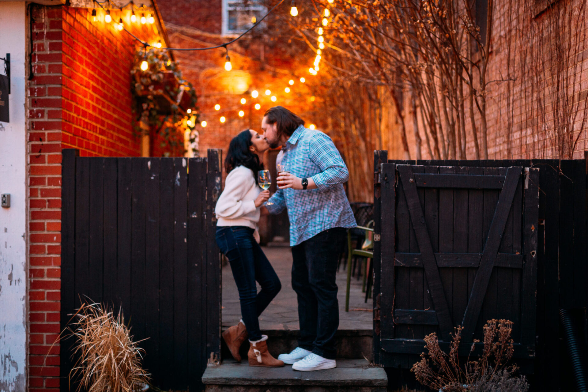 couple kissing with soft background lights in downtown scene