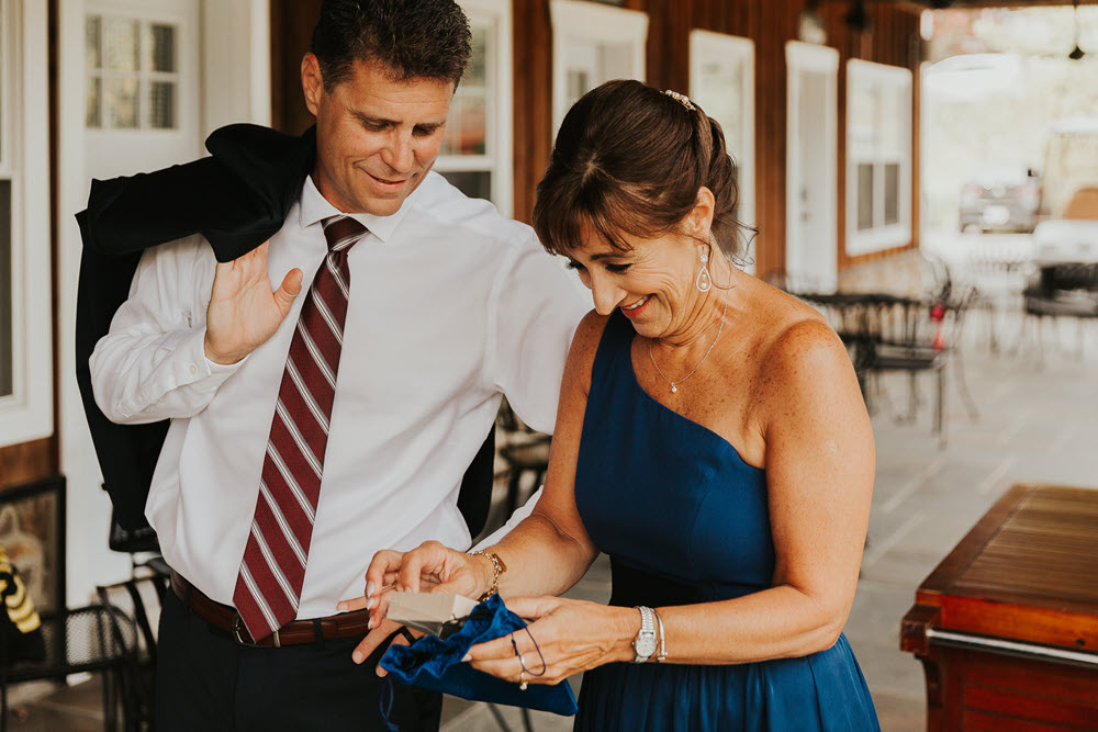 Groom and his mother sharing a quiet moment at Zion Springs, a rustic, elegant barn wedding venue in Northern Virginia.