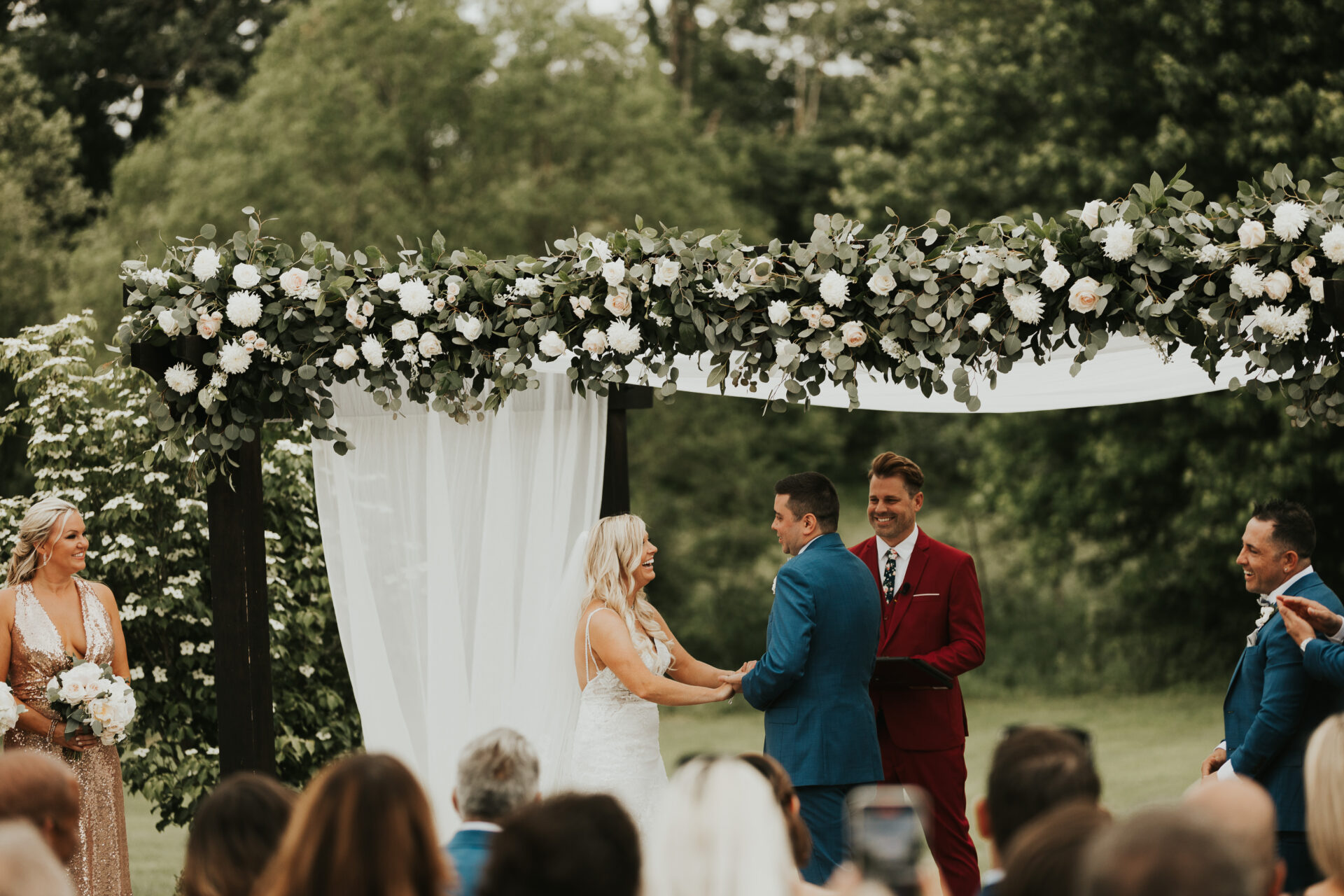 Zion Springs wedding ceremony under pergola with flowers