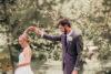 Zion Springs bride and groom dancing under a tree in summer