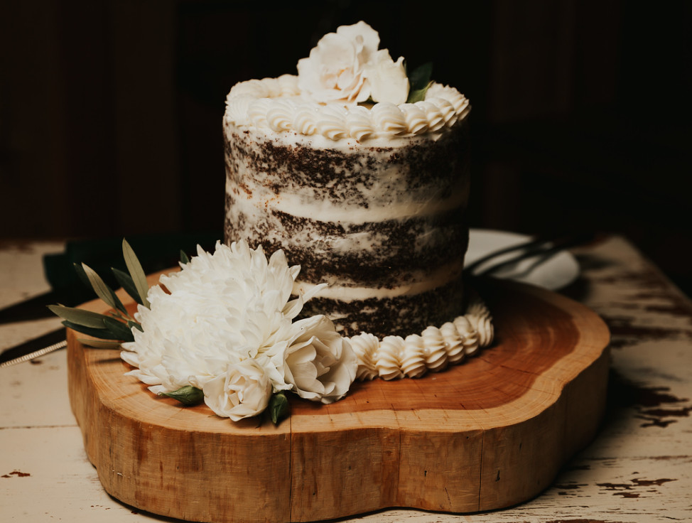 wedding cake on wood platter