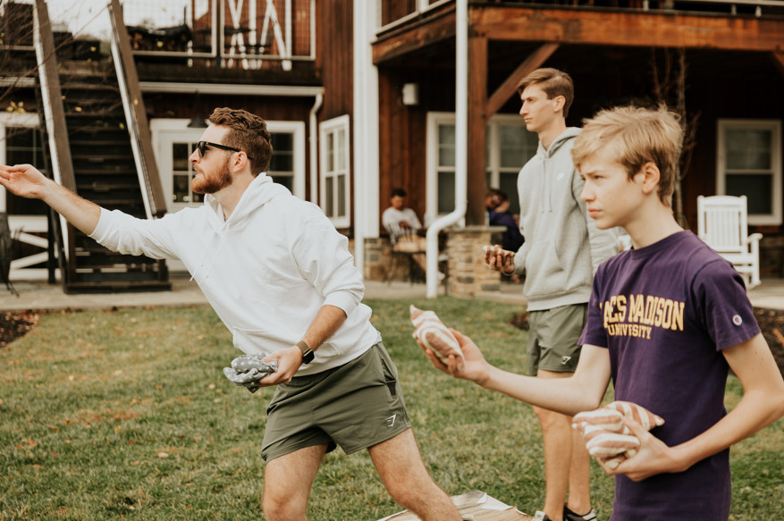 Zion Springs men and boys playing cornhole