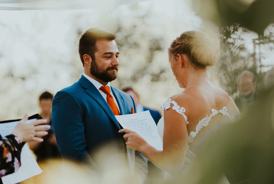 bride reading her vows to her husband