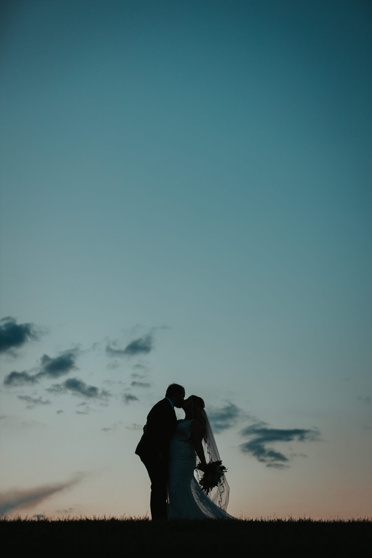 silhouette sunset bride and groom