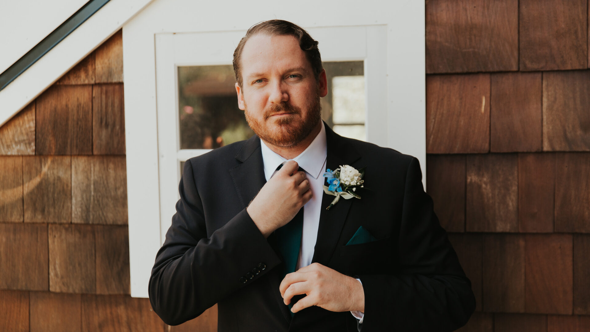 Groom fixing tie