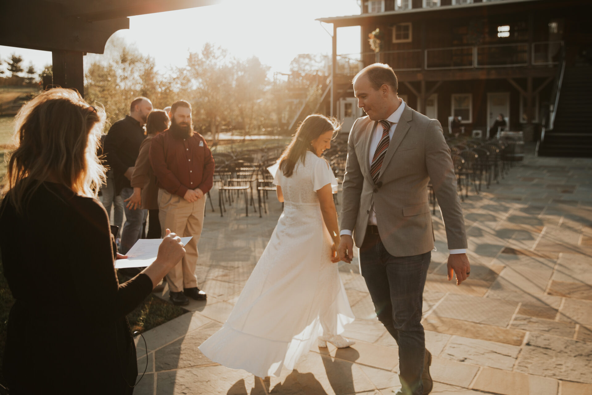 engaged couple dancing on cucina patio at Zion Springs setting sun