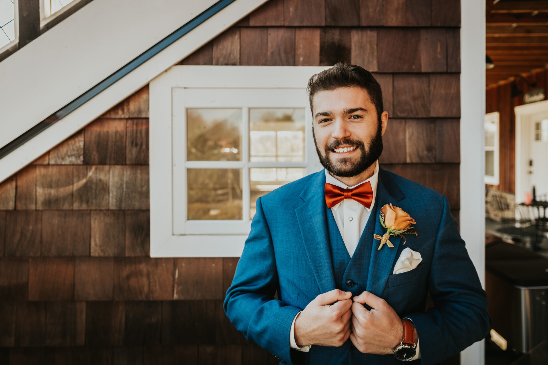 groom, blue suit, red bowtie, cedar shingles