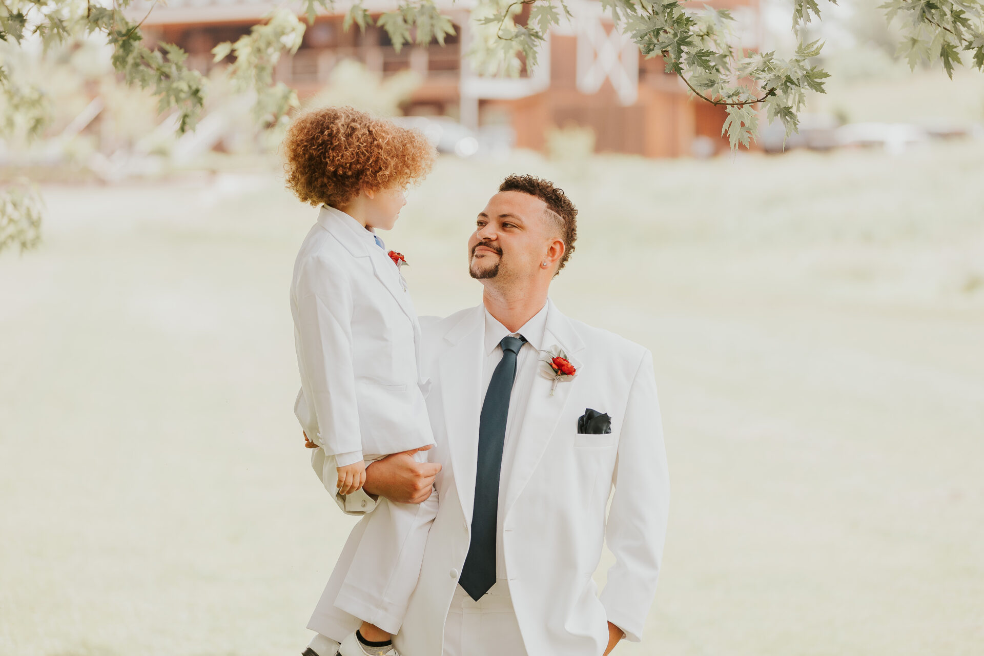 groom holding ring bearer