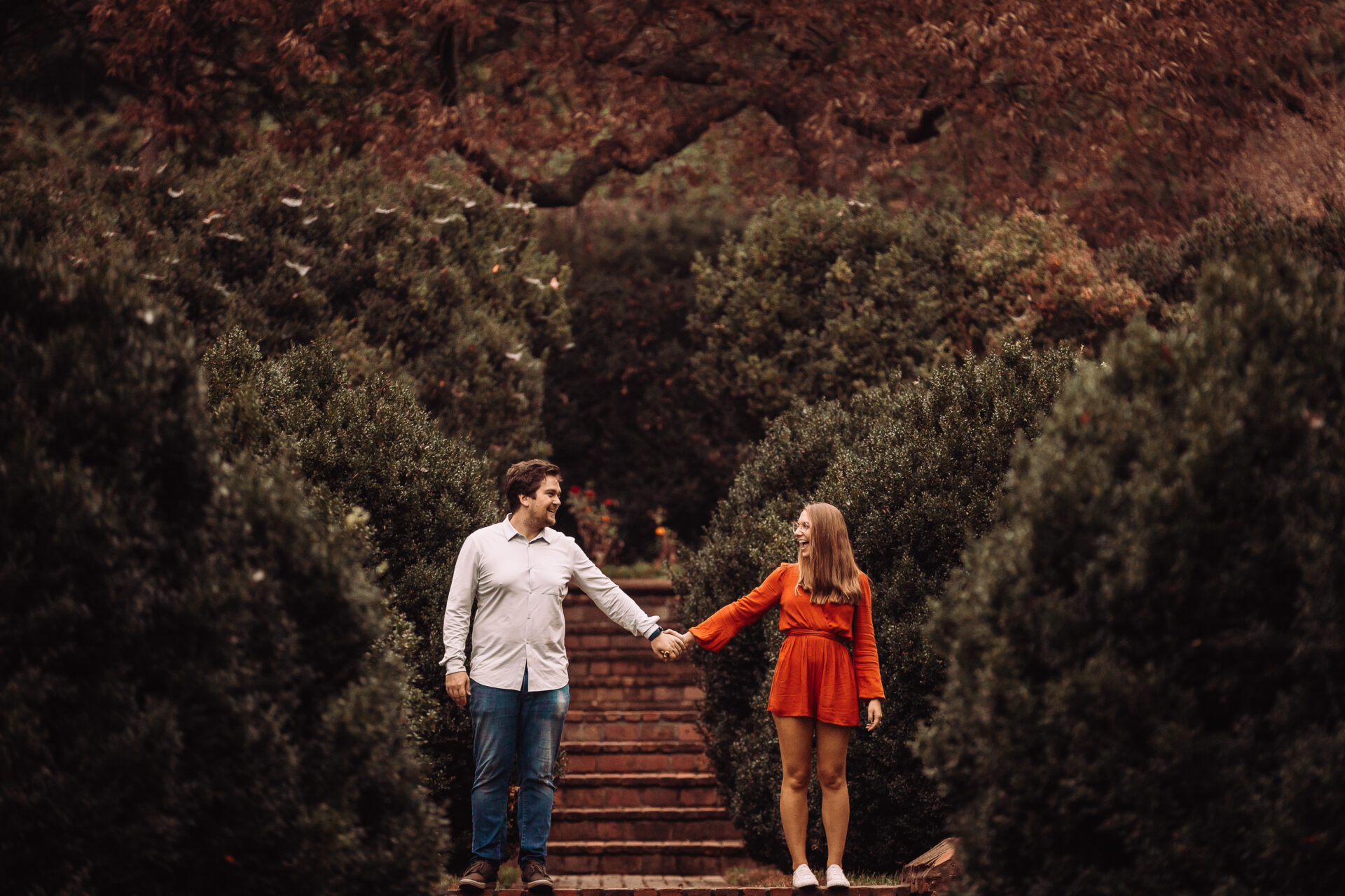 engaged couple holding hands