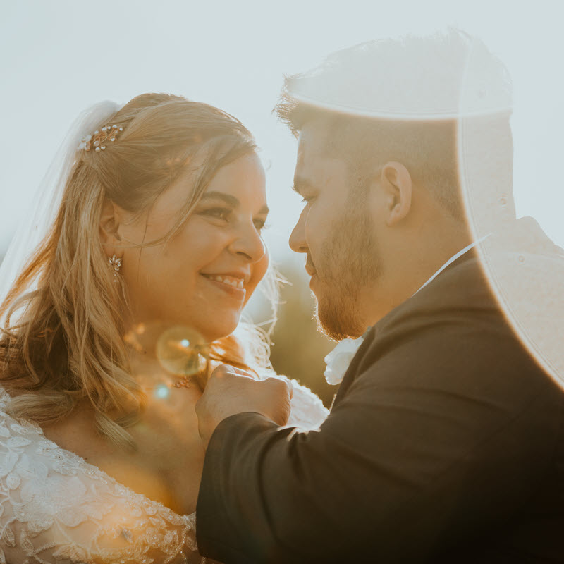 Newlyweds sharing a romantic moment in the barn at Zion Springs, an all-inclusive wedding venue in Northern Virginia.