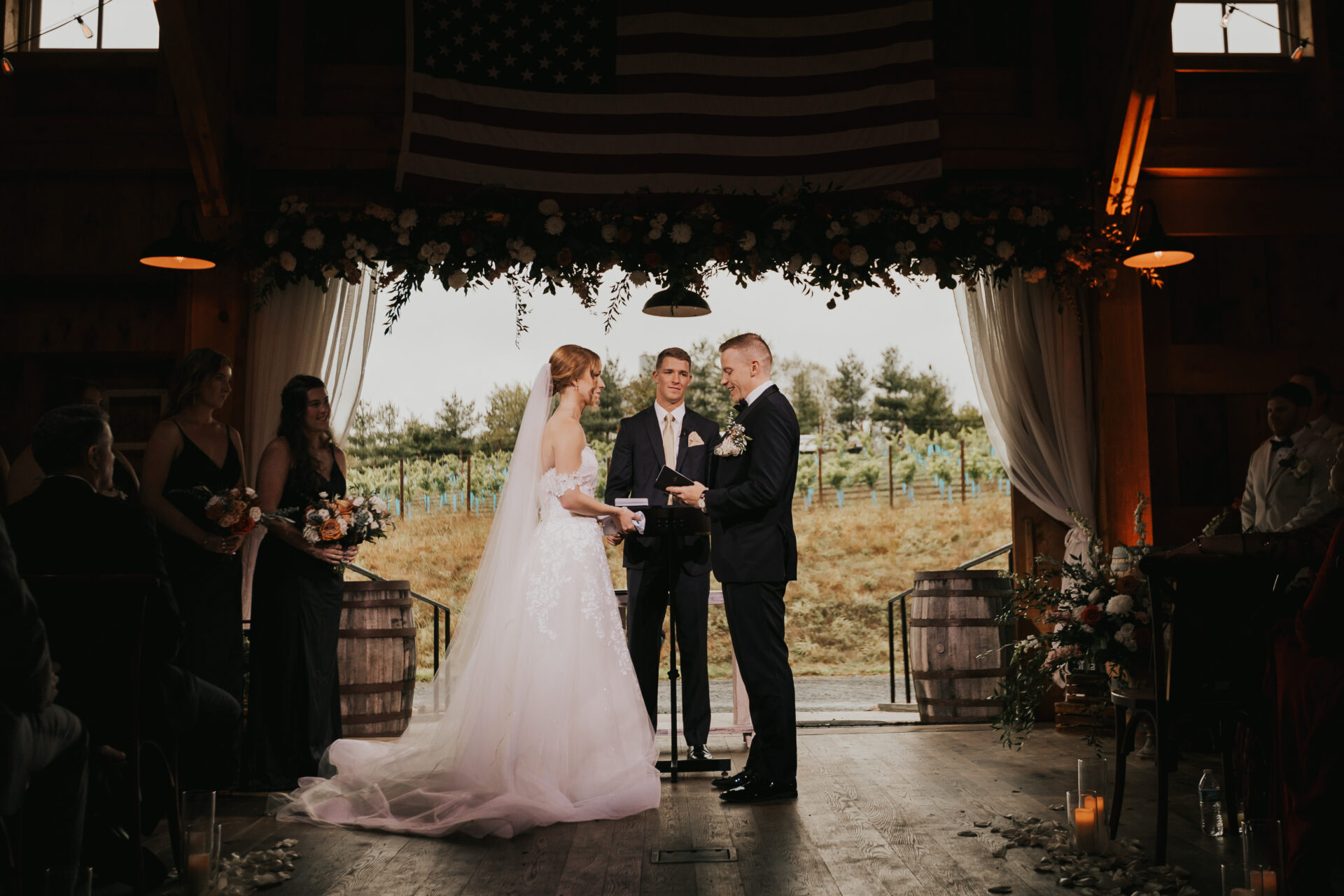 bride, groom, officiant, rustic barn, wedding ceremony, vows