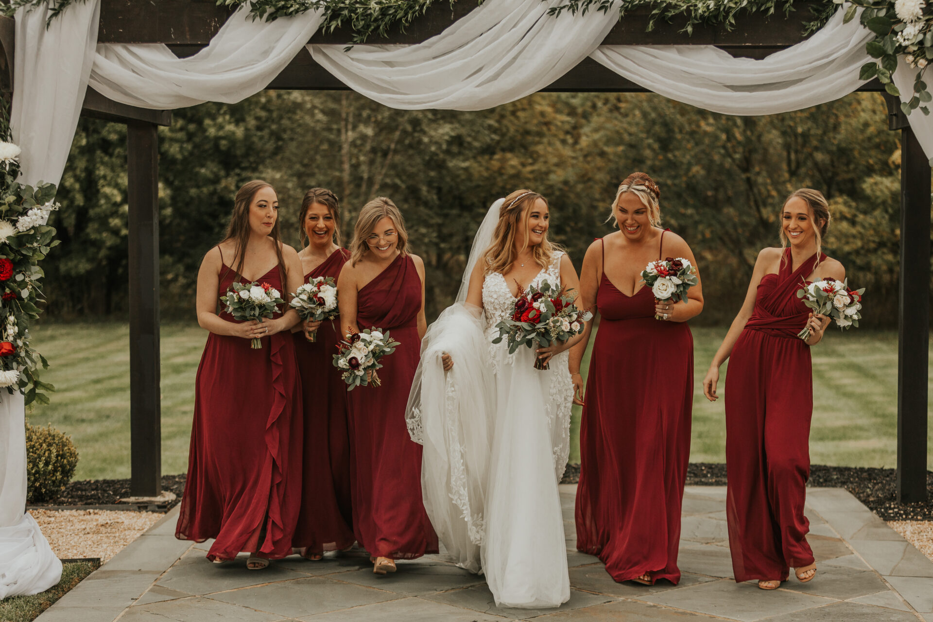 bride, bridesmaids, pergola, wedding ceremony, burgundy dress