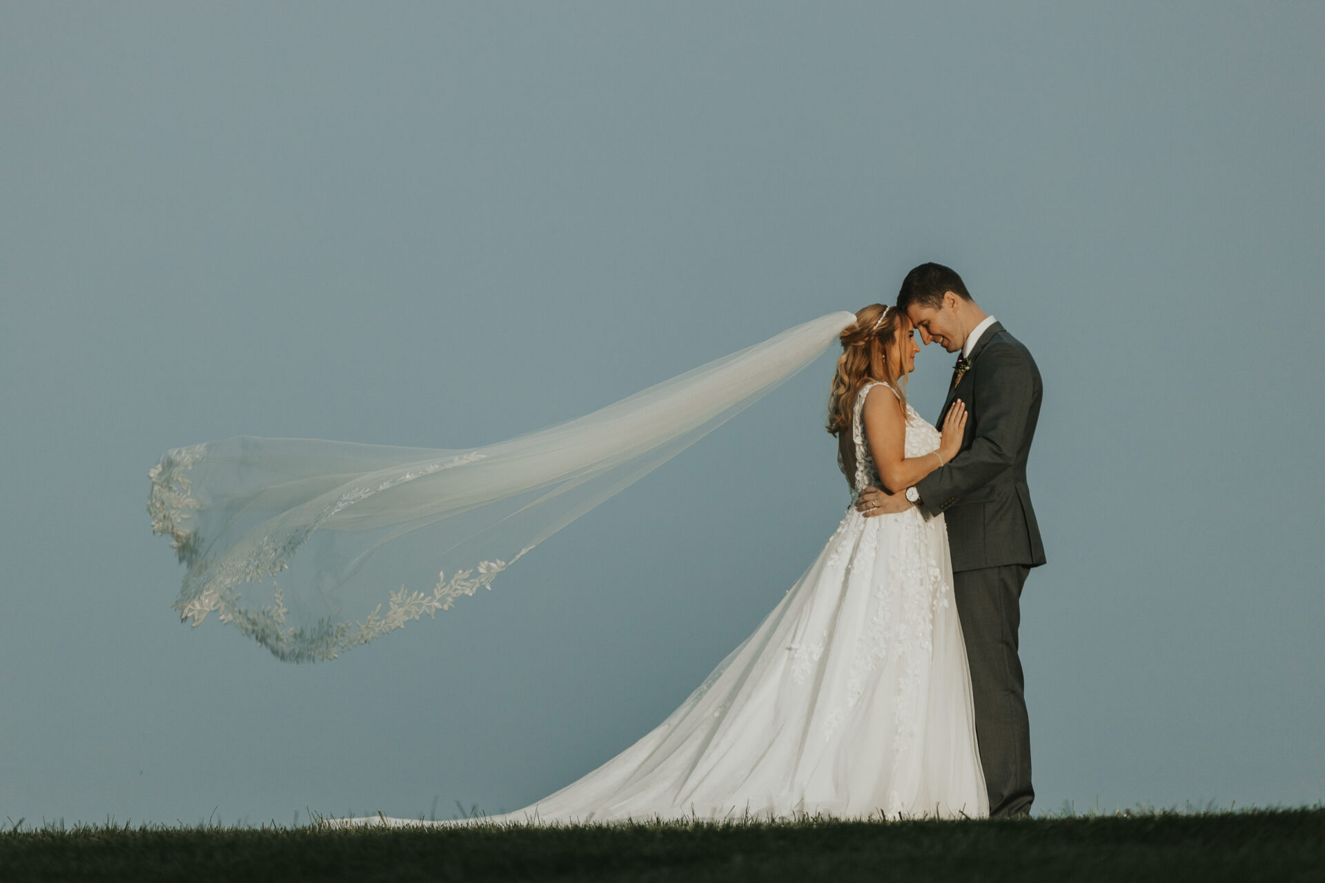 bride, groom, windswept veil