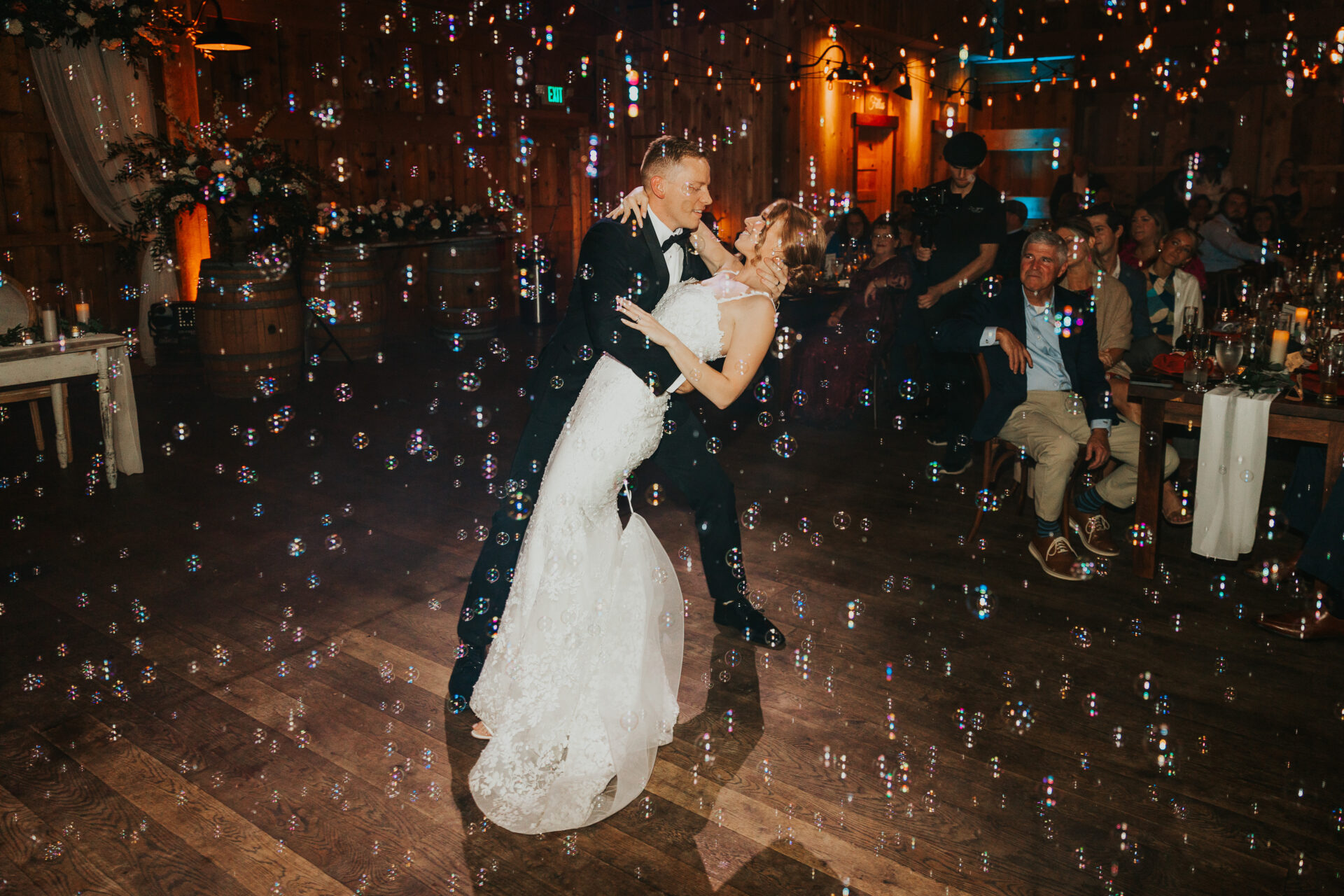 bride, groom, first dance, bubbles, rustic barn