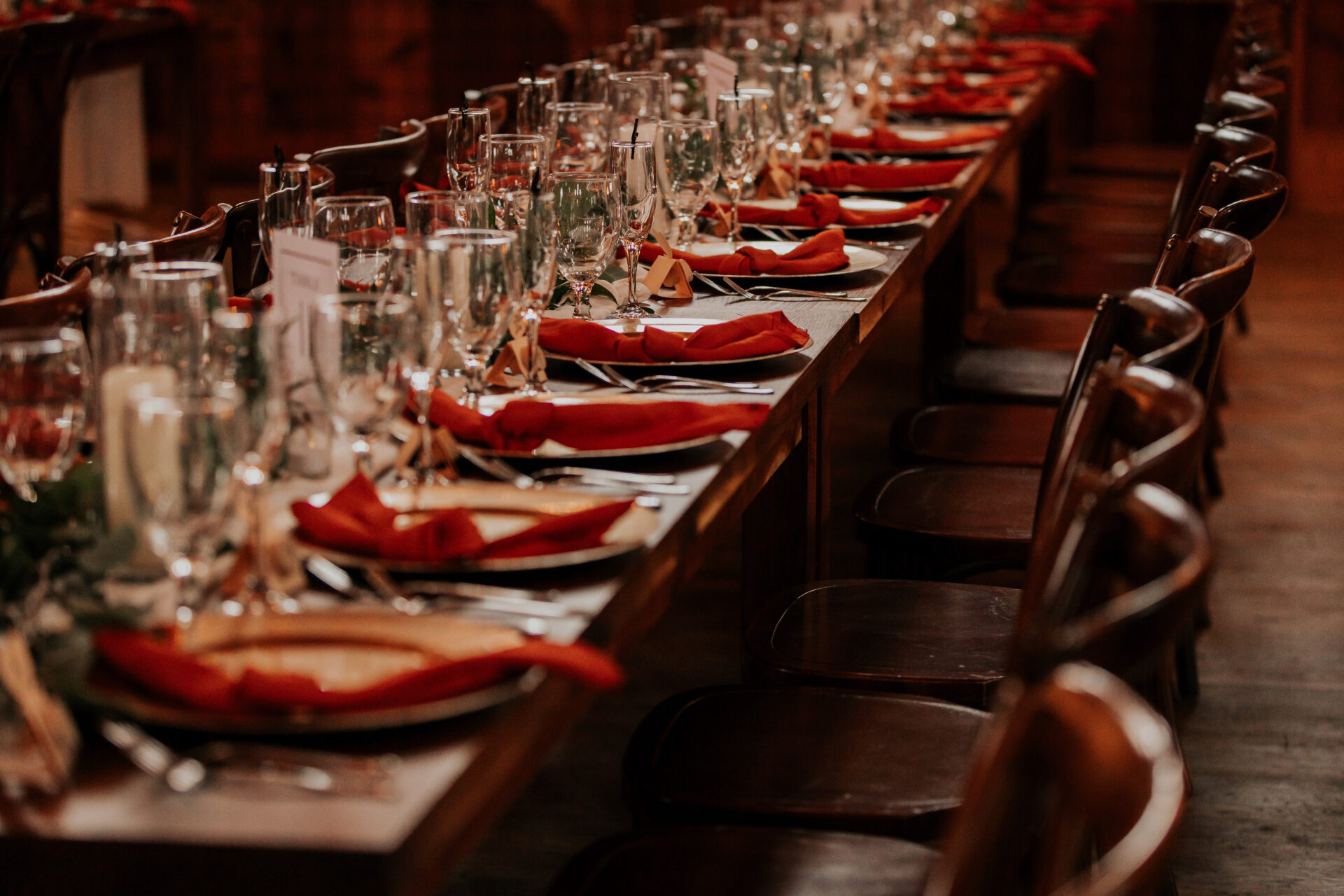 red napkins, rustic barn, table settings, wedding reception