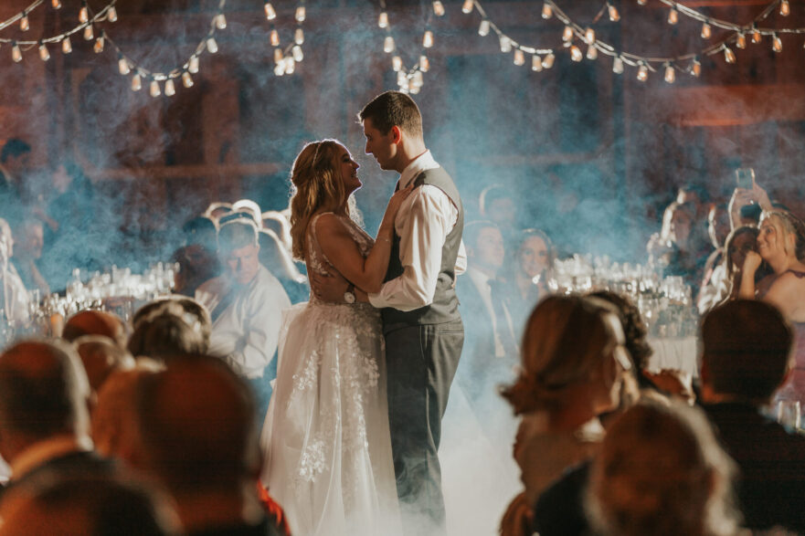 bride, groom, first dance, rustic barn, smoke, wedding reception