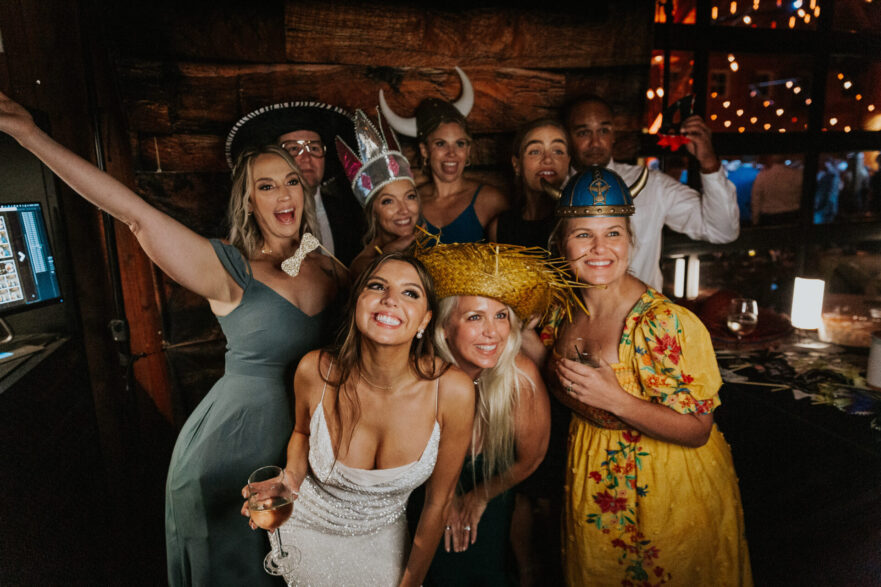 photo booth, wedding reception, bride, rustic barn