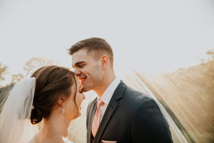 Newlyweds sharing a romantic moment at Zion Springs, an all-inclusive barn wedding venue in Loudoun County.