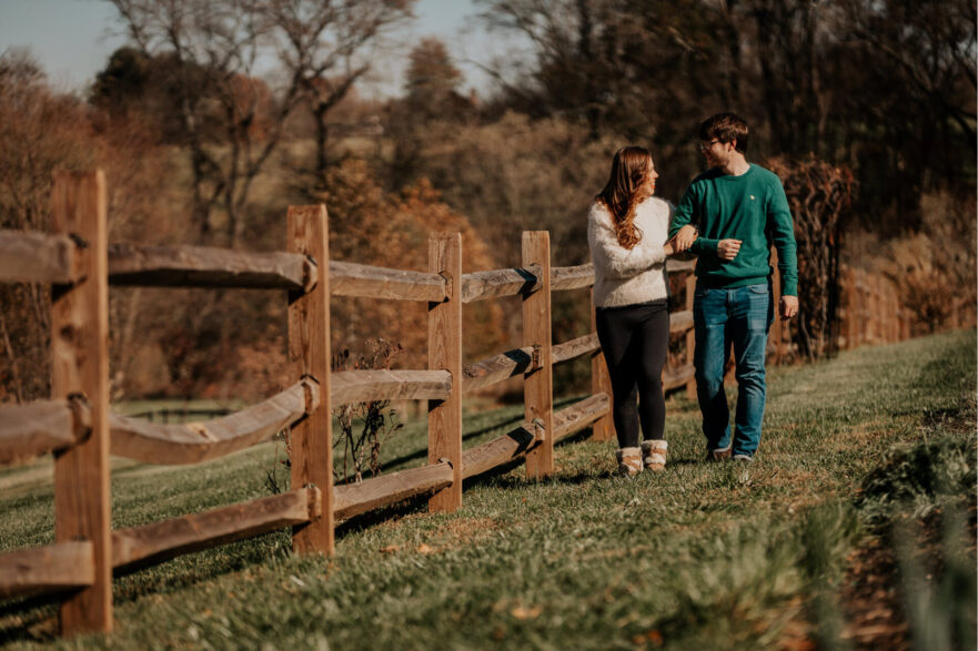 An engaged couple planning their brunch in a garden setting at Zion Springs.