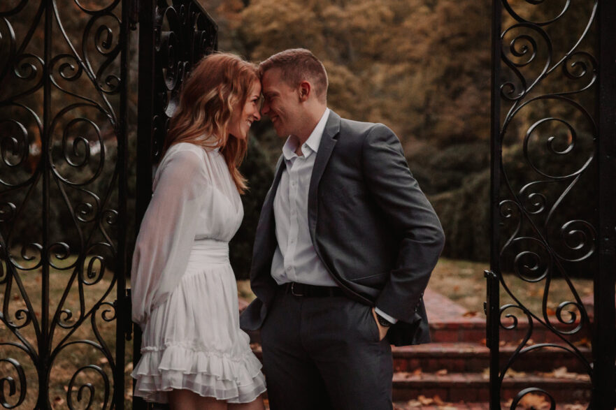 Newly engaged couple sharing a romantic moment on their wedding venue tour.