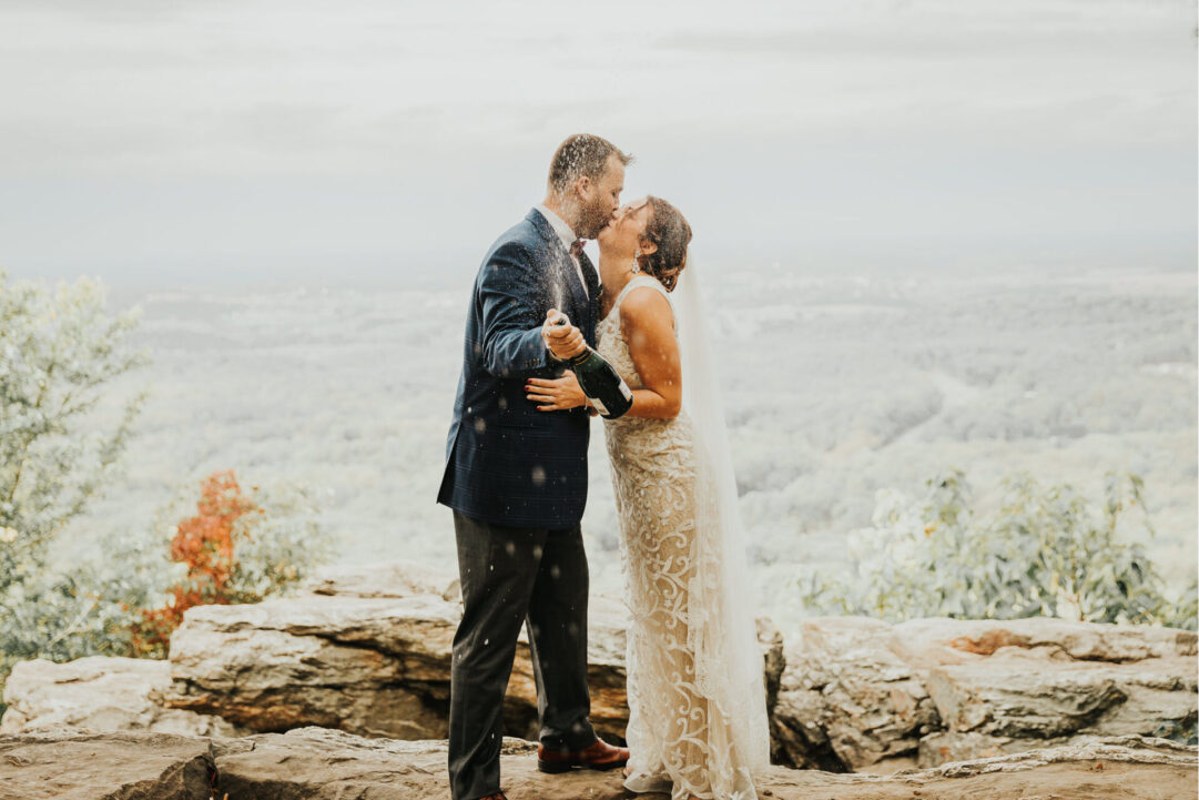 Newlywed couple celebrating with champagne at Zion Springs, a scenic all-inclusive wedding venue in Virginia.