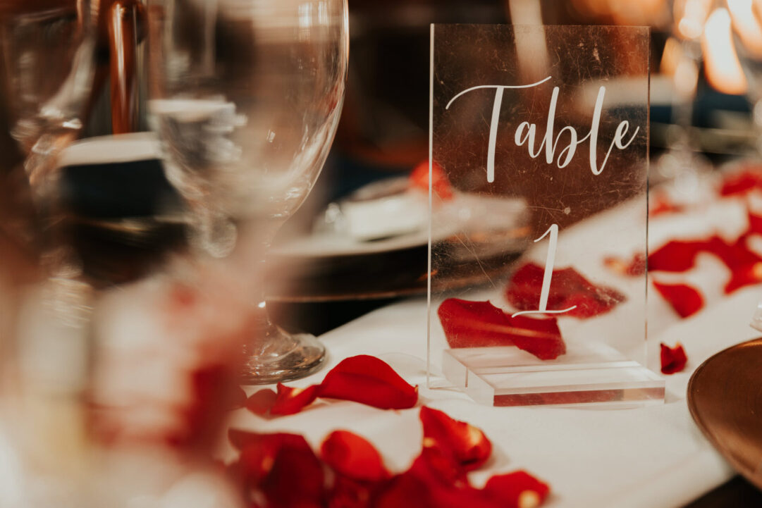 Elegant Table Setting with Rose Petals in the Reception Barn